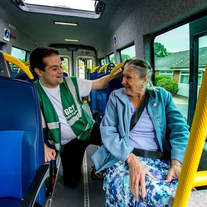 Green Community Transport volunteer driver A Green Community Transport volunteer driver talking to a passenger in a minibus.